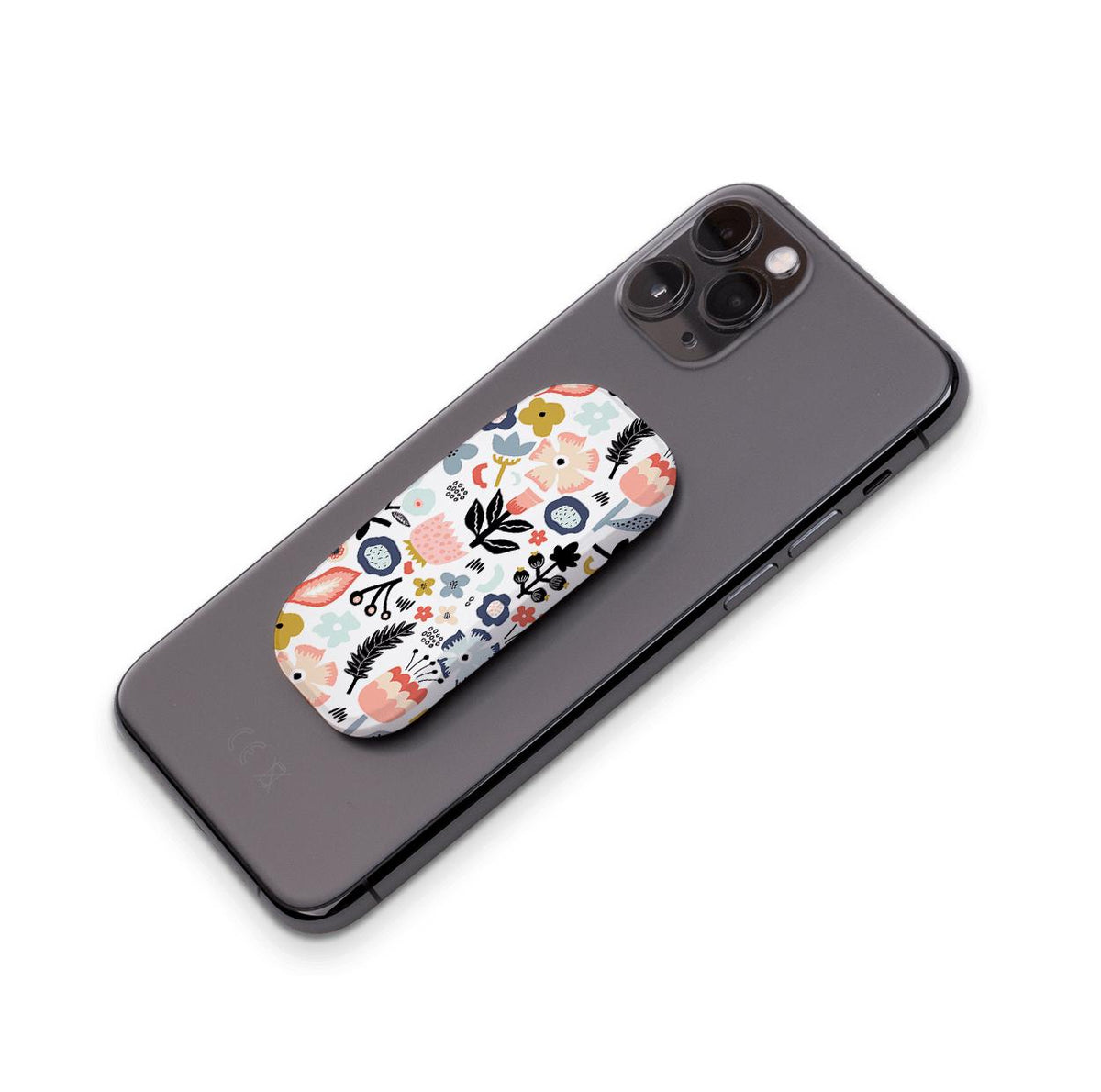 Aarhus phone stand with a colorful floral pattern attached to the back of a black smartphone.