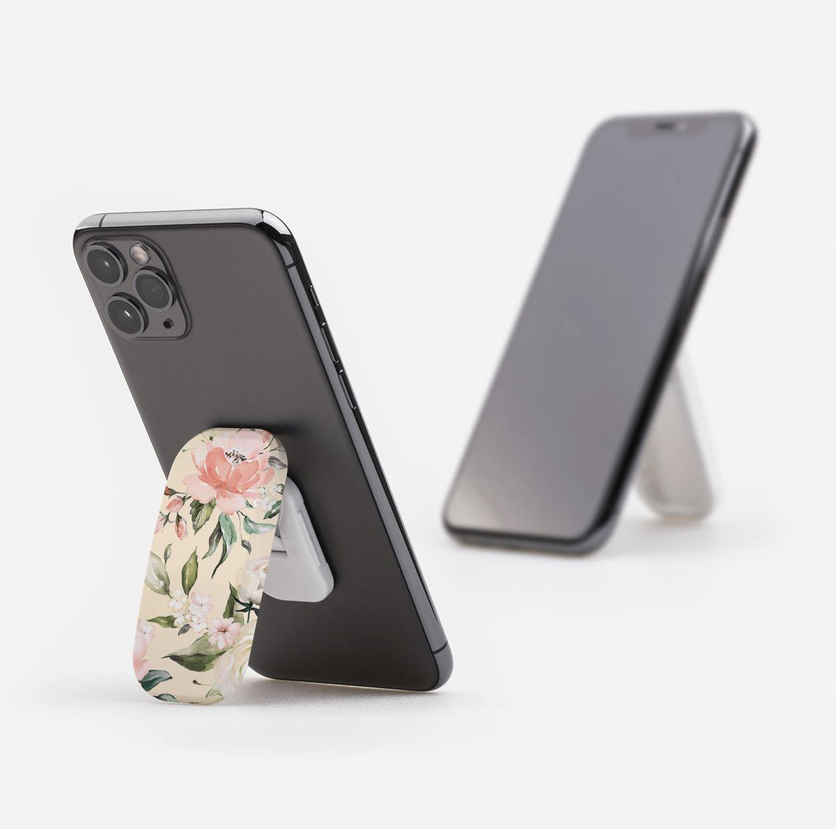 Abinger phone stand with a floral pattern attached to the back of a smartphone, functioning as a landscape and portrait stand.