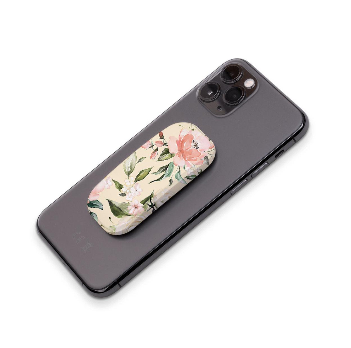 Abinger floral phone stand with a cream background and pink flower print attached to the back of a black smartphone.