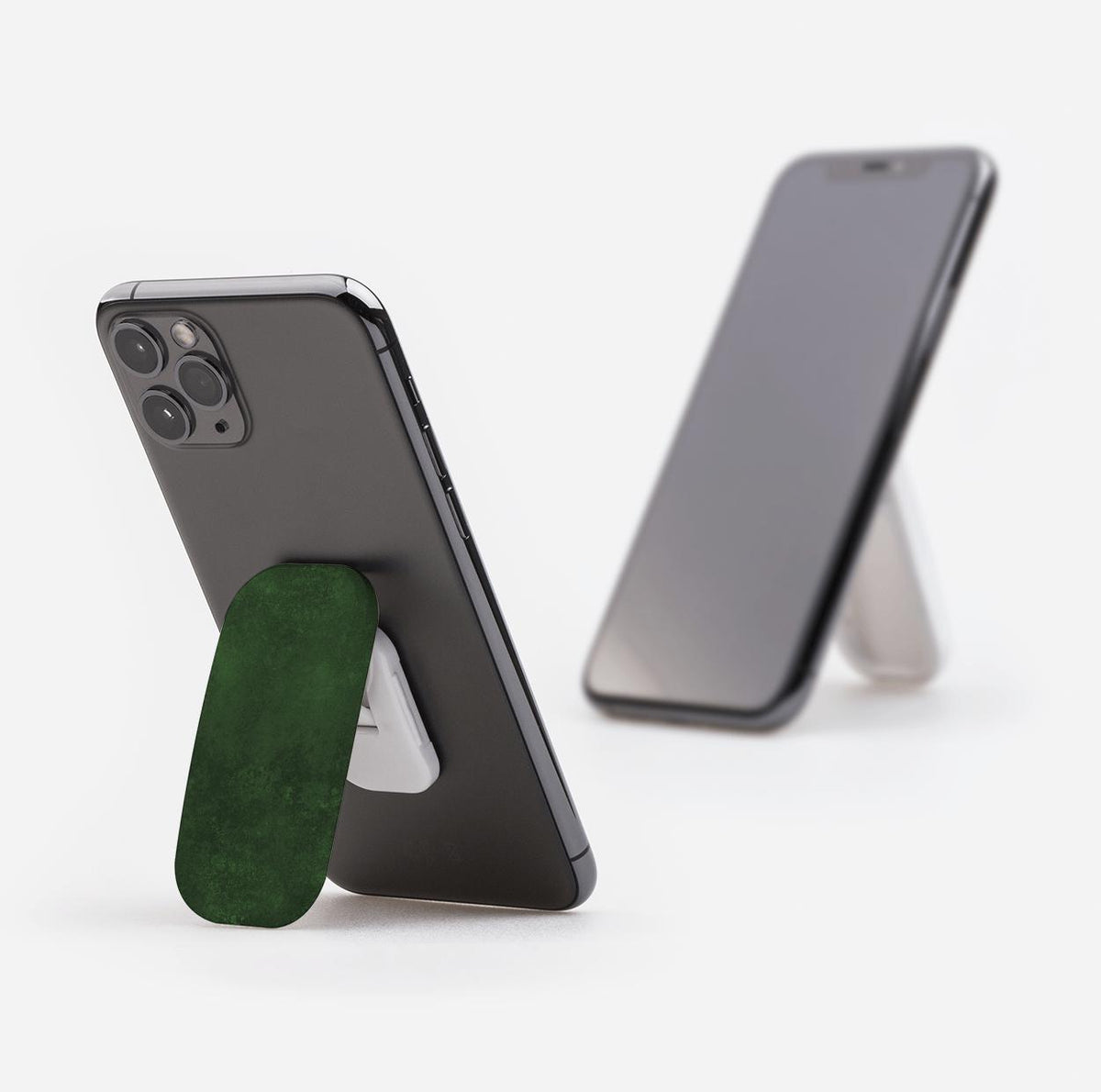 Absinthe green Clickit phone stand attached to a smartphone, functioning as a sturdy portrait and landscape kickstand.