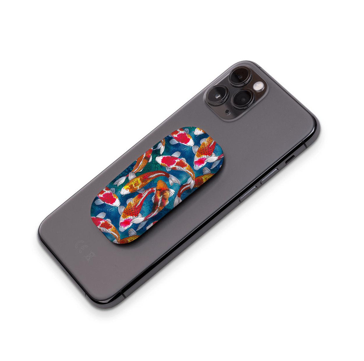 Adachi phone stand with a vibrant koi fish pattern attached to the back of a black smartphone.
