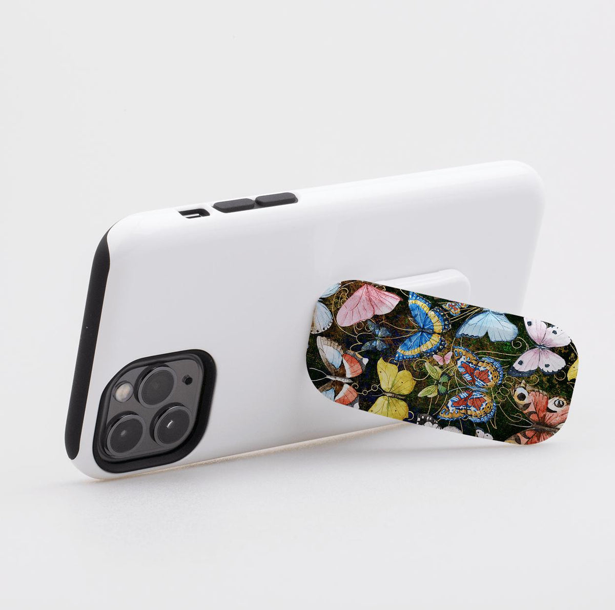 Arebury phone stand with a colorful butterfly pattern attached to the back of a white smartphone case.