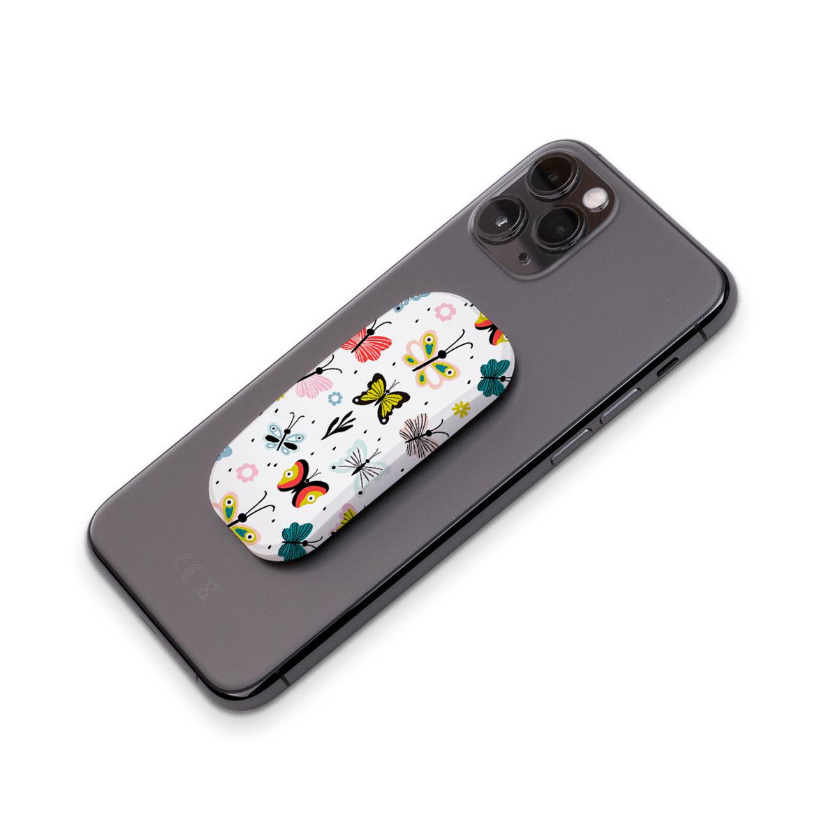 Avesta Clickit phone stand with a colorful butterfly pattern attached to the back of a black smartphone.