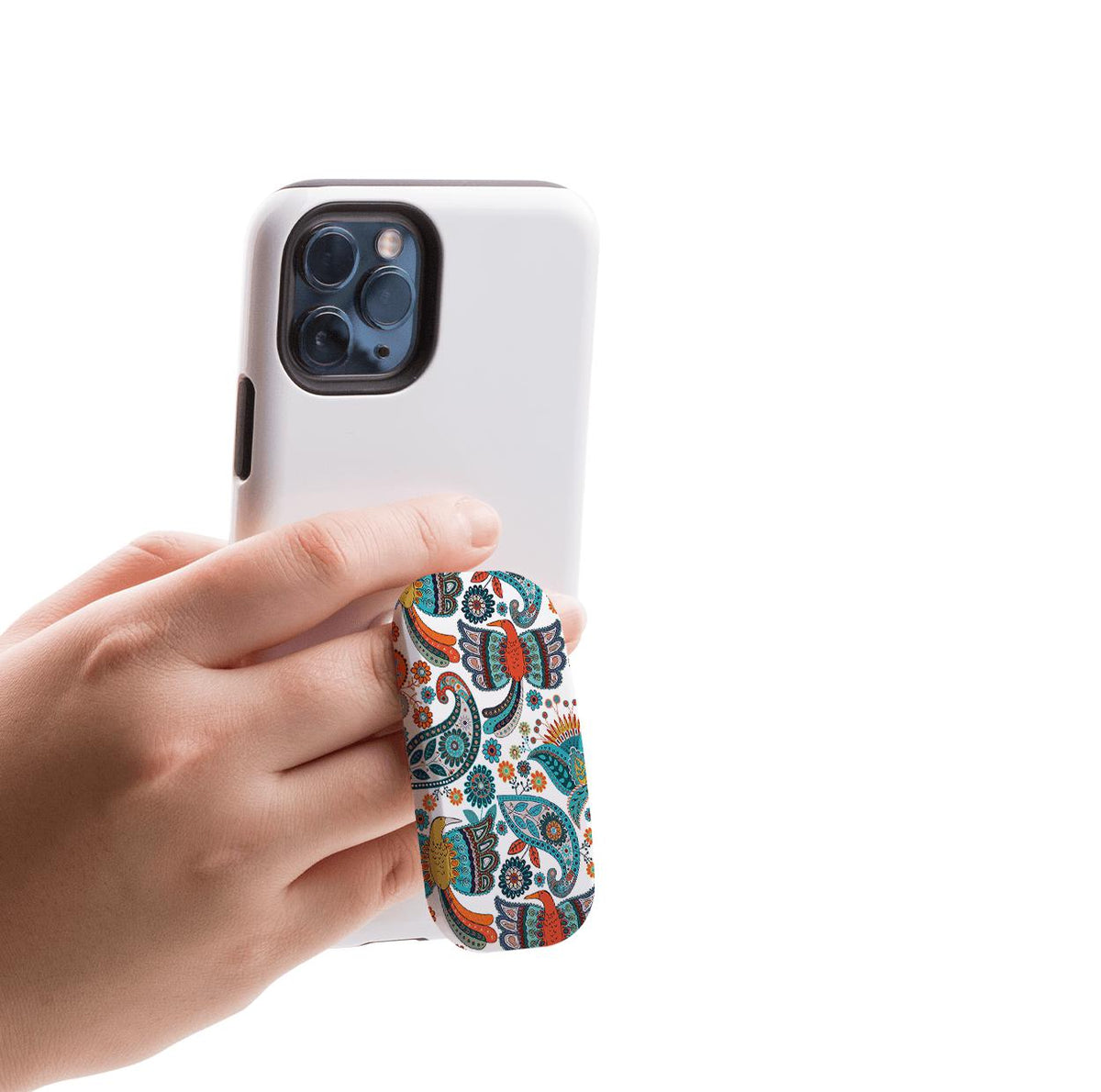 Hand holding a white smartphone with a colorful, floral-patterned Clickit phone stand attached to the back.