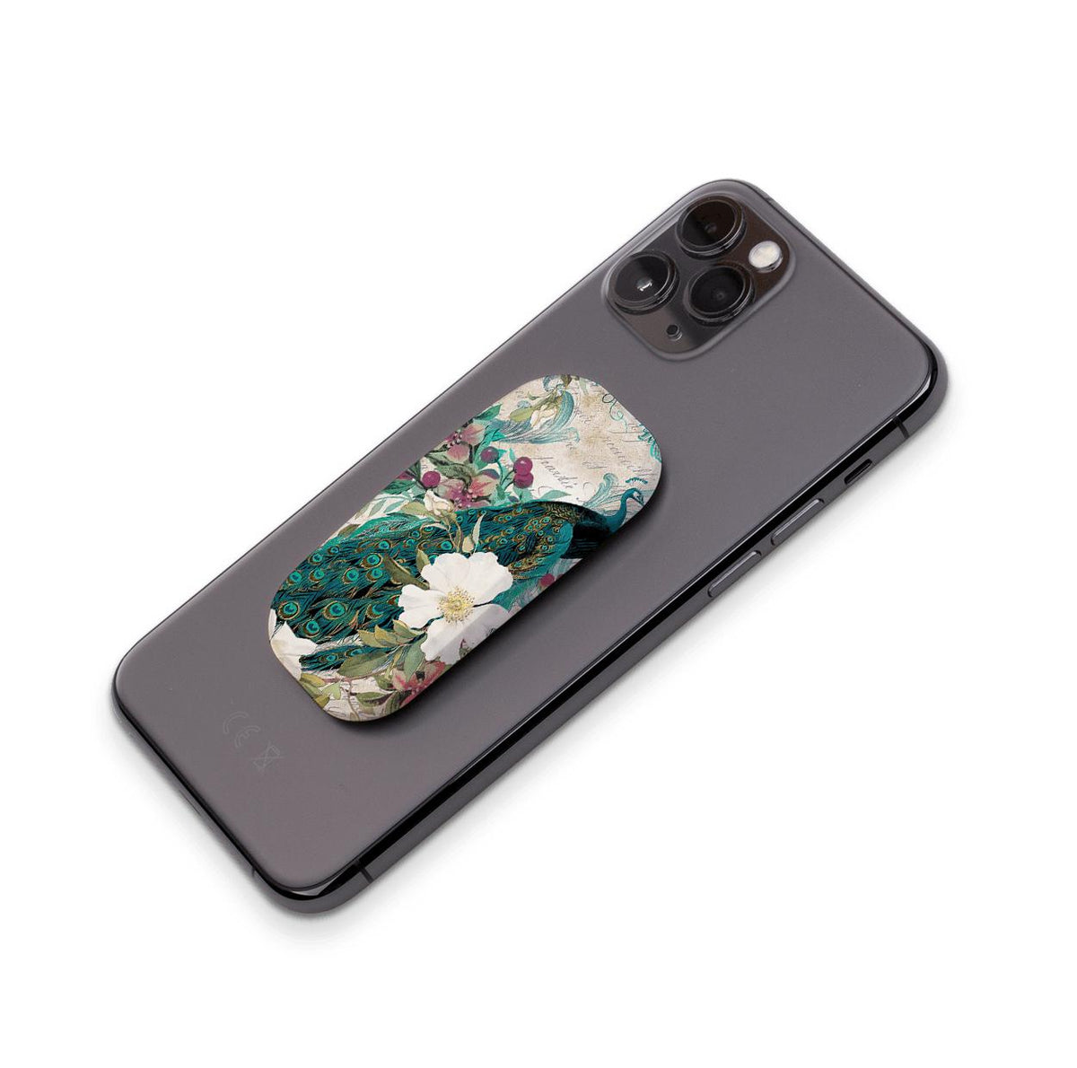 Oval phone stand with a peacock and floral print attached to the back of a black smartphone.