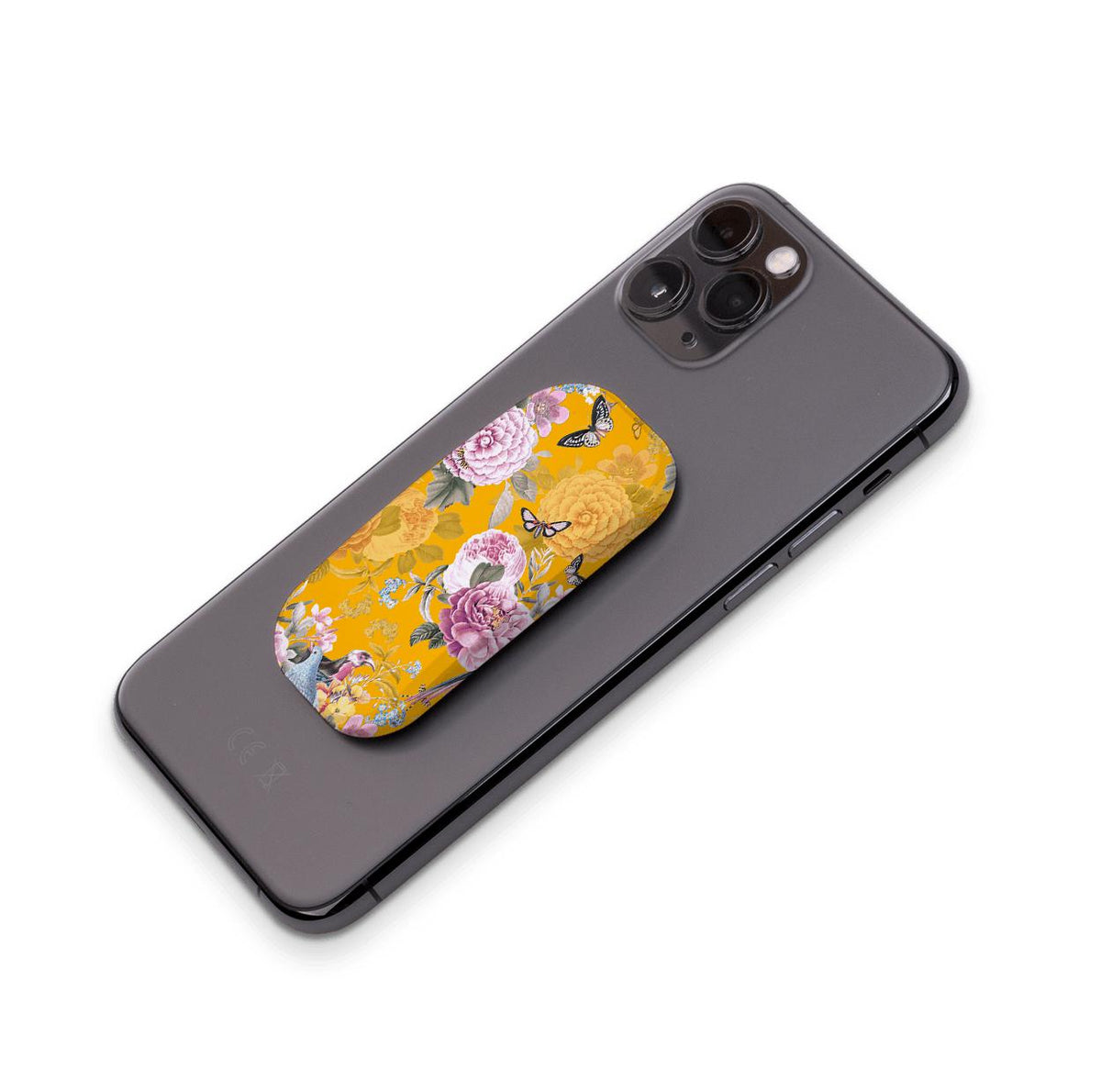 Barnes phone stand in yellow with a floral butterfly print attached to the back of a black smartphone.