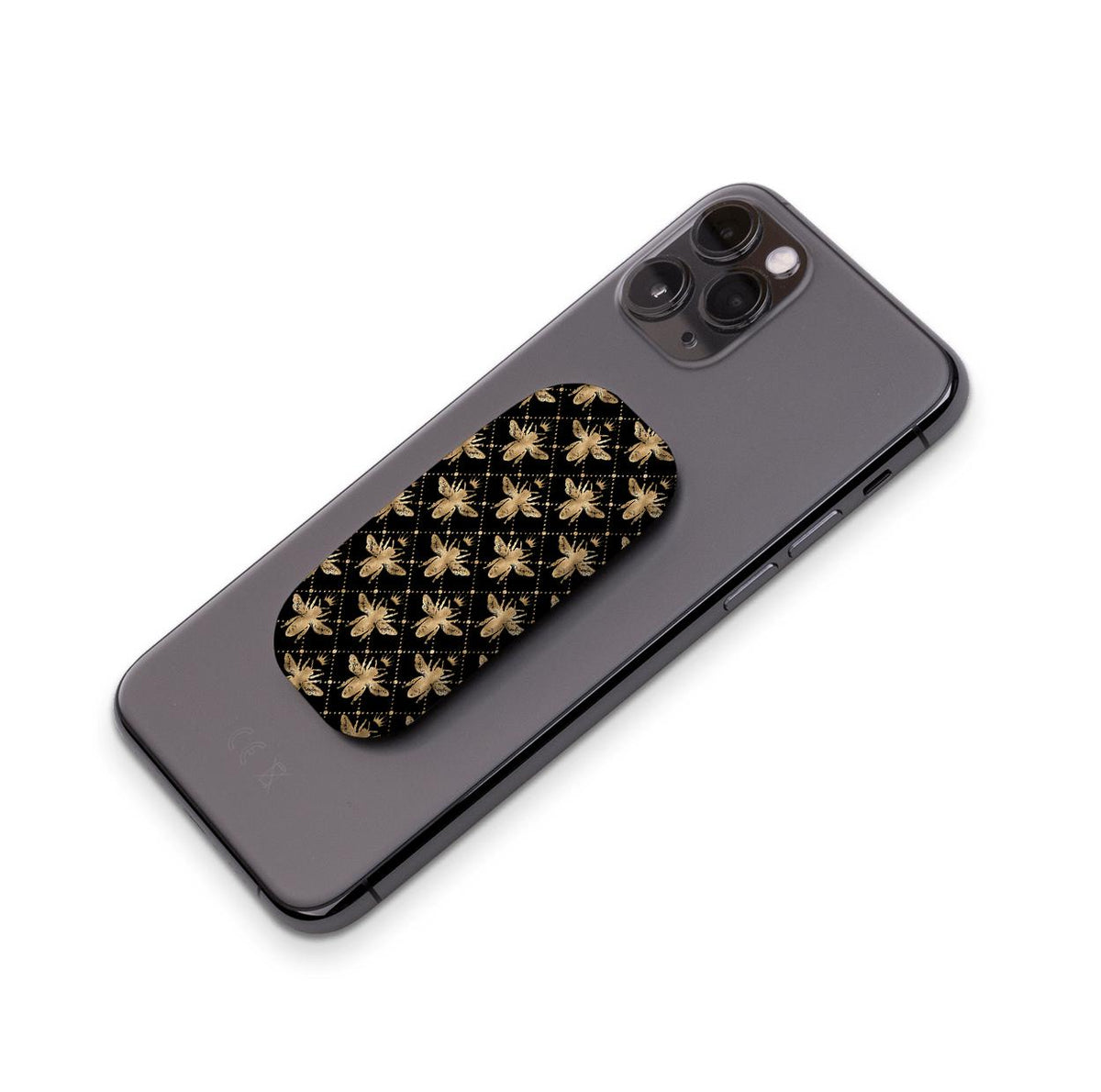 Black and gold bee-patterned Clickit phone stand attached to the back of a grey smartphone.