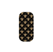 Clickit phone stand featuring a black background with a gold metallic bee and crown pattern in a pill-shaped design.