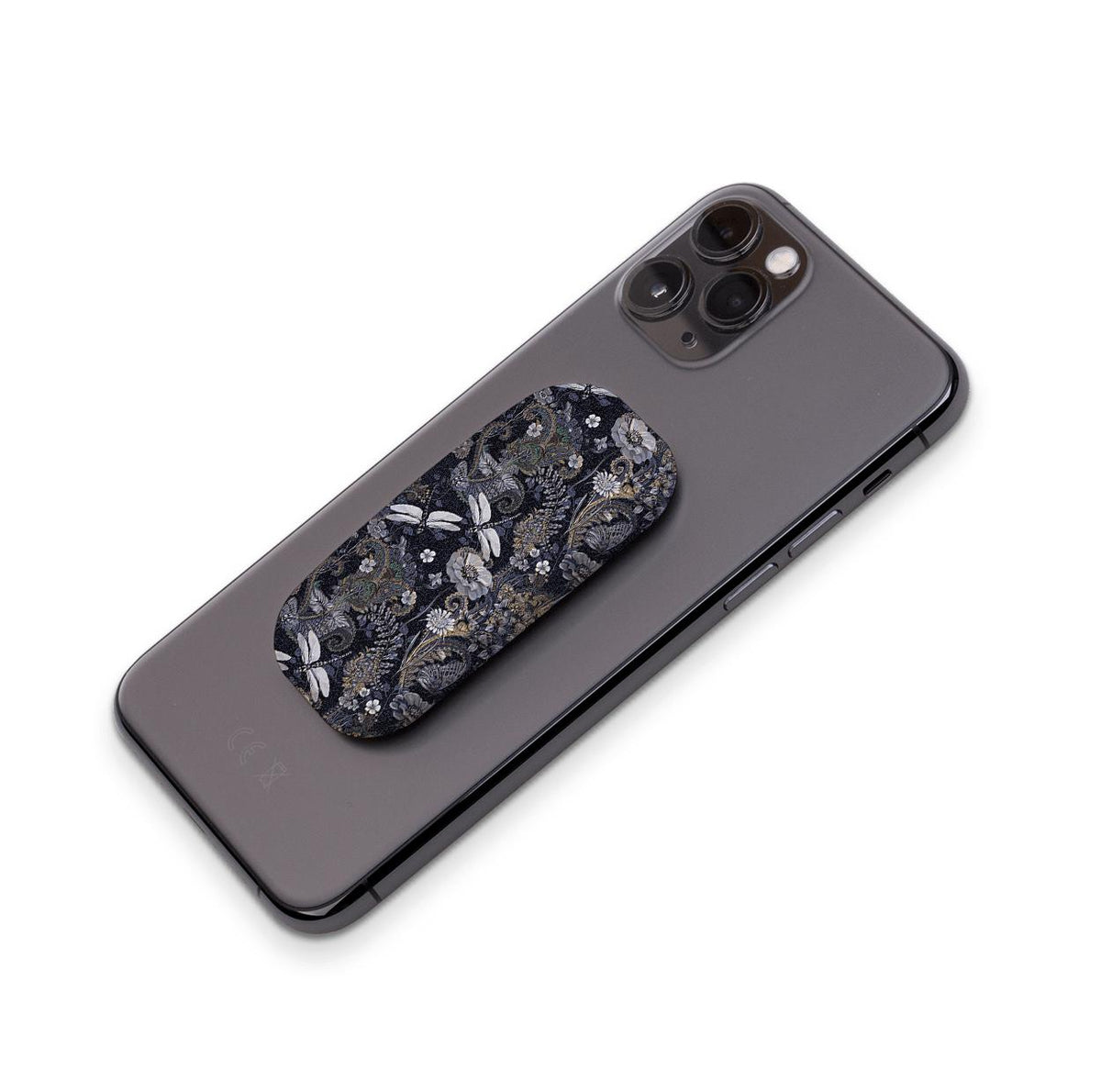 Support de téléphone Clickit au motif Belsay, avec un design floral sombre et de libellule fixé au dos d'un smartphone gris