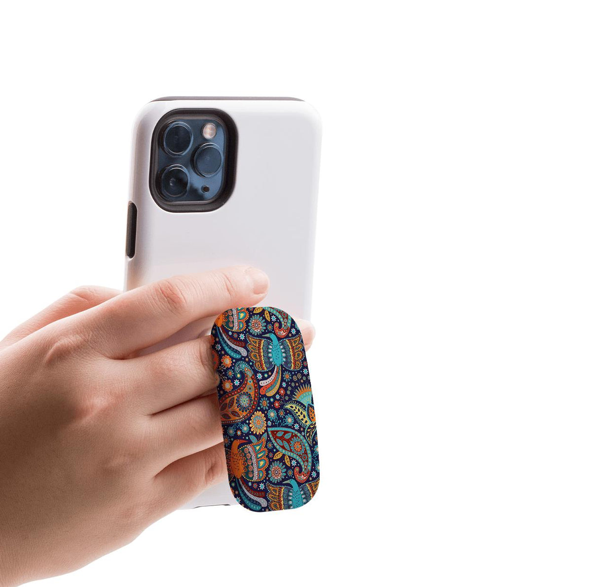 Hand holding a white smartphone with a colorful, blue-toned paisley patterned Bettyhill Clickit phone stand attached.