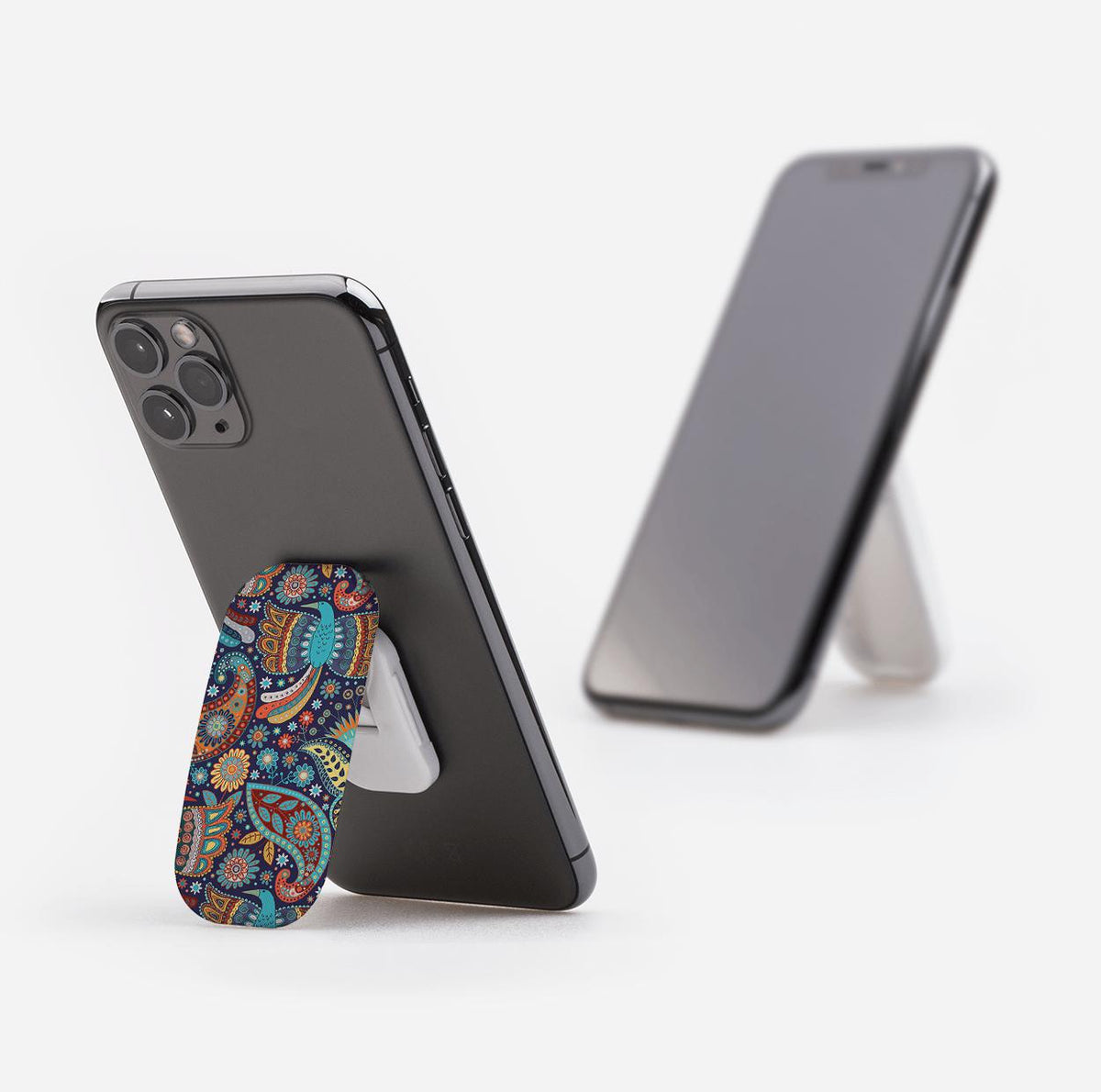Bettyhill phone stand with a colorful paisley pattern attached to a smartphone, acting as a grip and landscape stand.