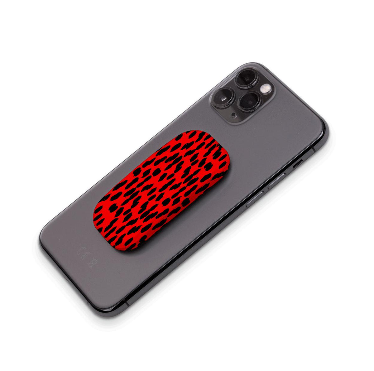 Black and red leopard print Flickit phone stand attached to the back of a black smartphone.