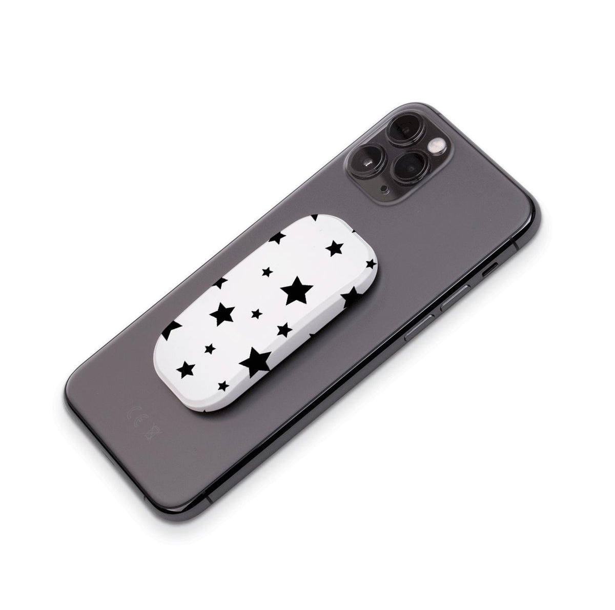 White Flickit phone stand with a black star pattern attached to the back of a grey smartphone.