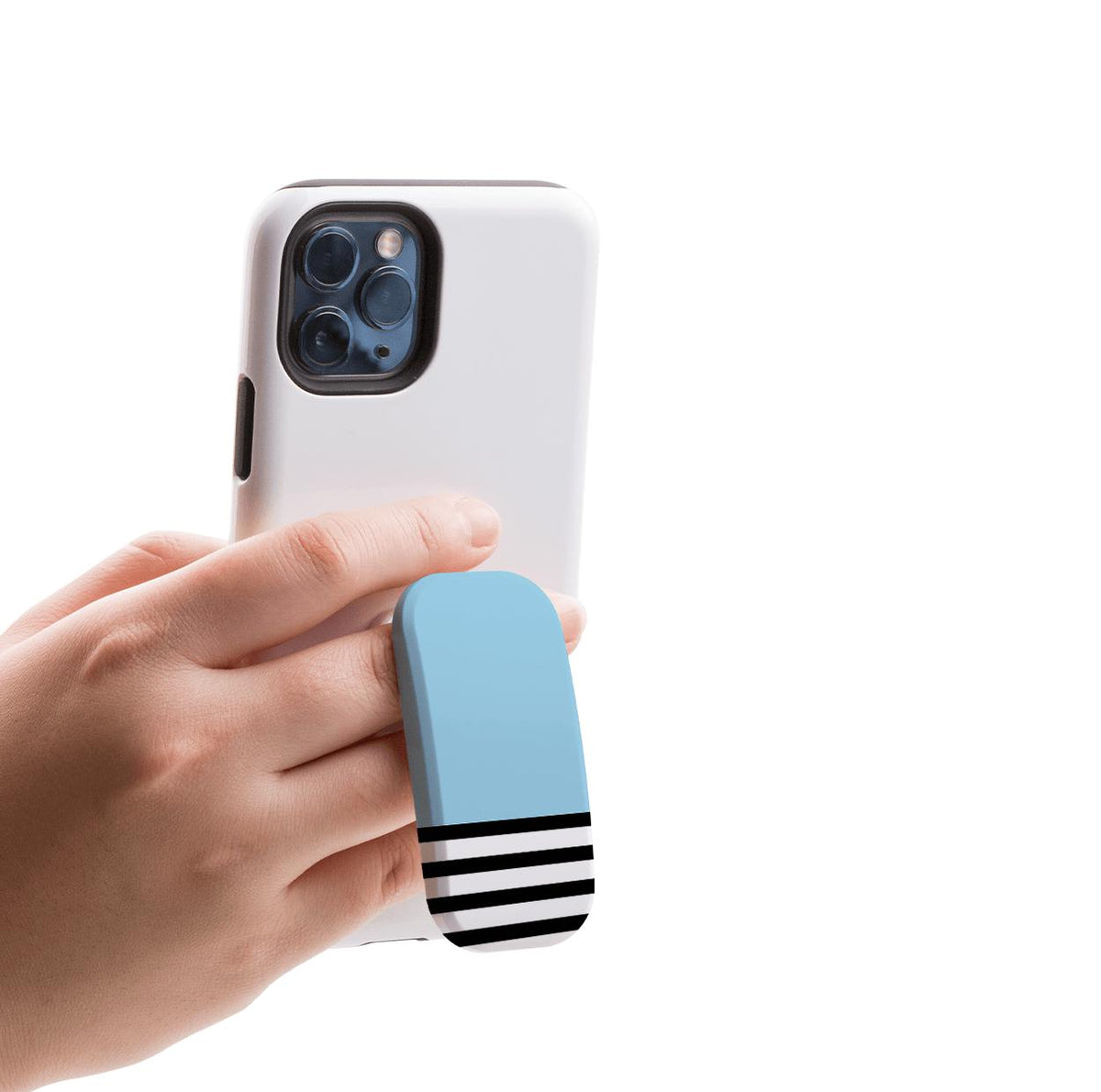 Hand holding a white smartphone with a light blue and black striped adhesive grip stand attached to the back.