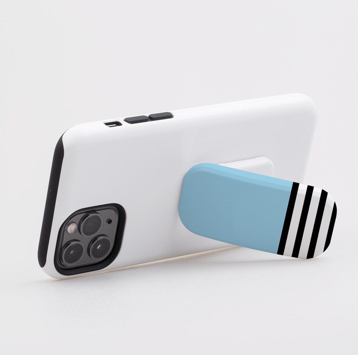 Blue and black-striped phone stand attached to a white smartphone case, functioning as a landscape kickstand.