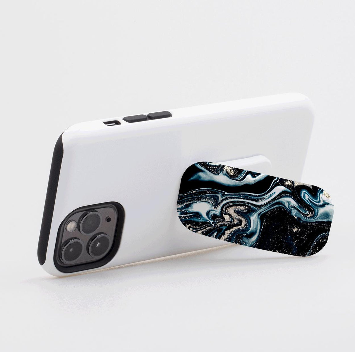 Blue Royalty Flickit phone stand with a swirling blue, black, and gold marble pattern attached to a white smartphone.