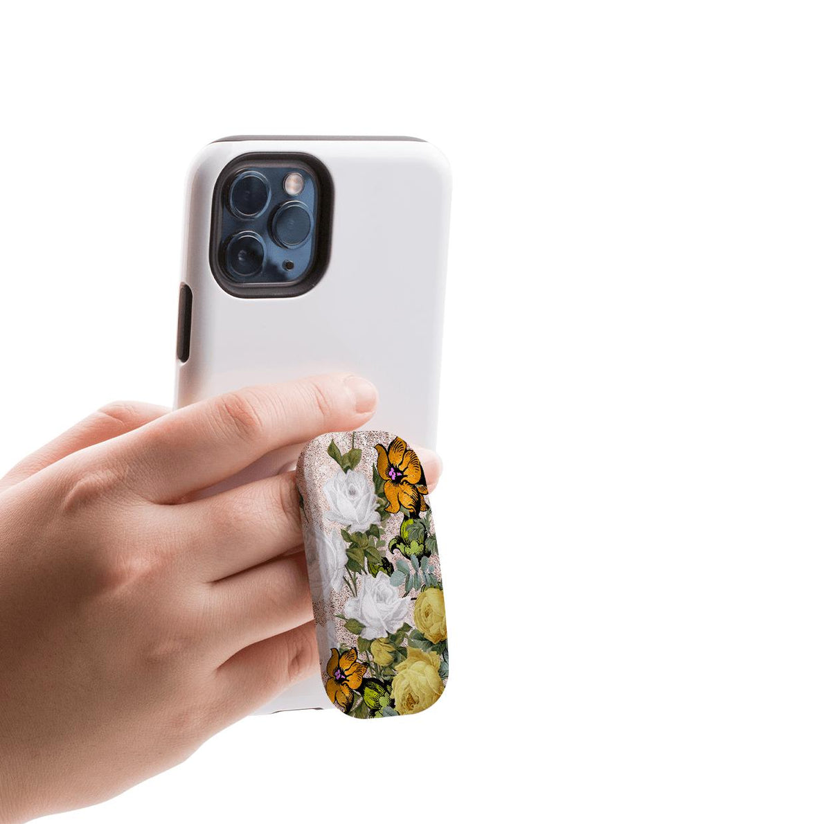 Hand holding a white smartphone with an oval floral-patterned Clickit stand featuring yellow and white roses.