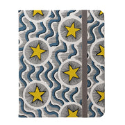 Celestial vegan leather iPad Pro case with a yellow star and blue wave pattern, featuring a flat grey elastic closure.