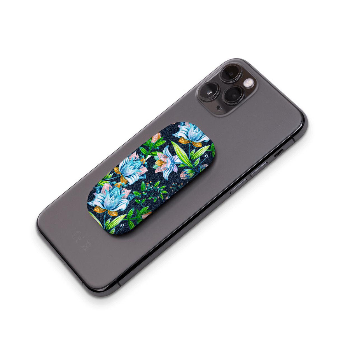 Chester phone stand with a dark blue floral pattern attached to the back of a black smartphone.