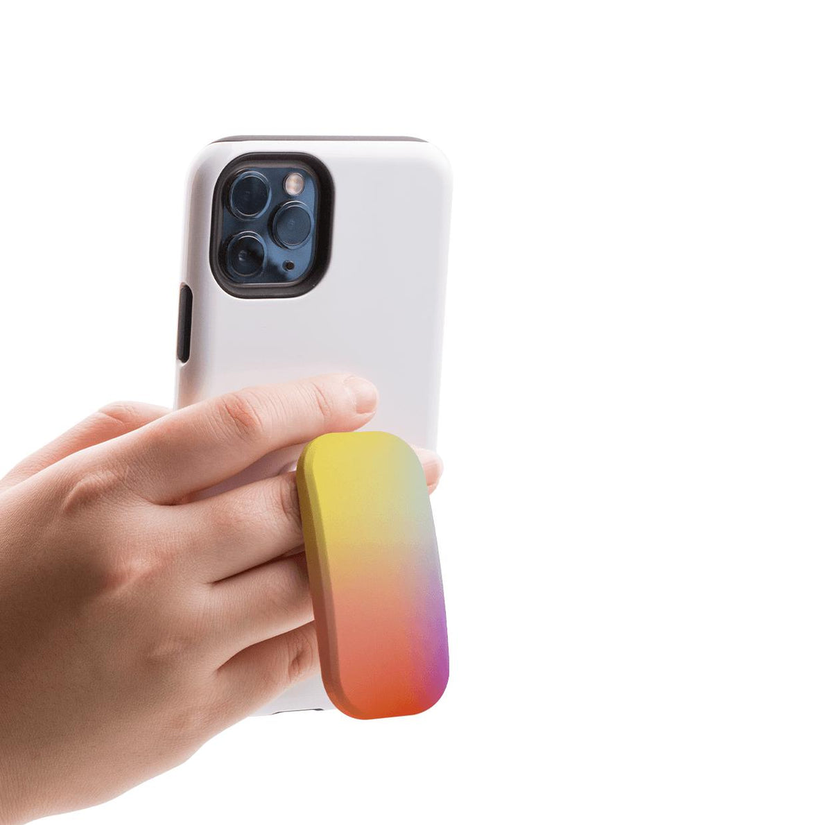 Hand holding a white smartphone with a rectangular, yellow-to-orange gradient Clickit phone stand attached to the back.