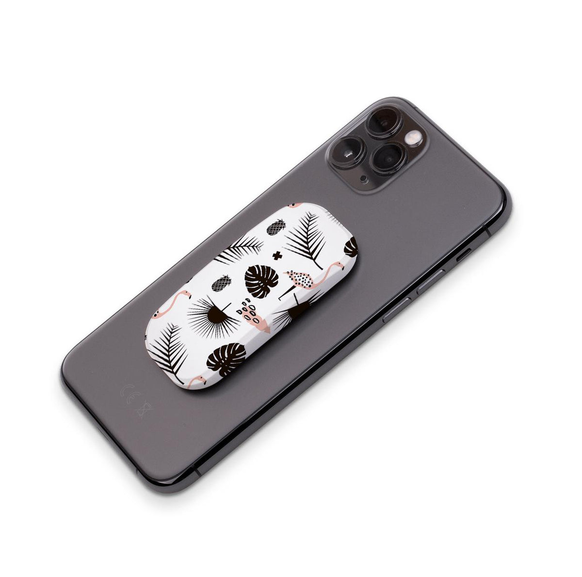 Dark Palms phone stand with a tropical flamingo and leaf pattern attached to the back of a black smartphone.