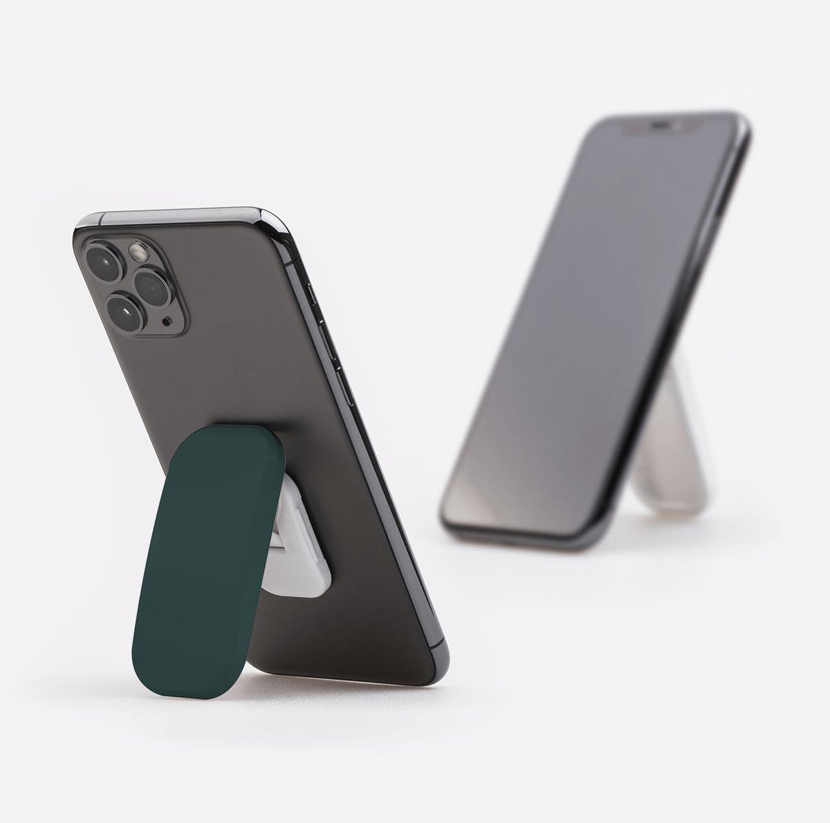 Forest green rectangular phone stand attached to a smartphone, functioning as a kickstand in portrait mode.