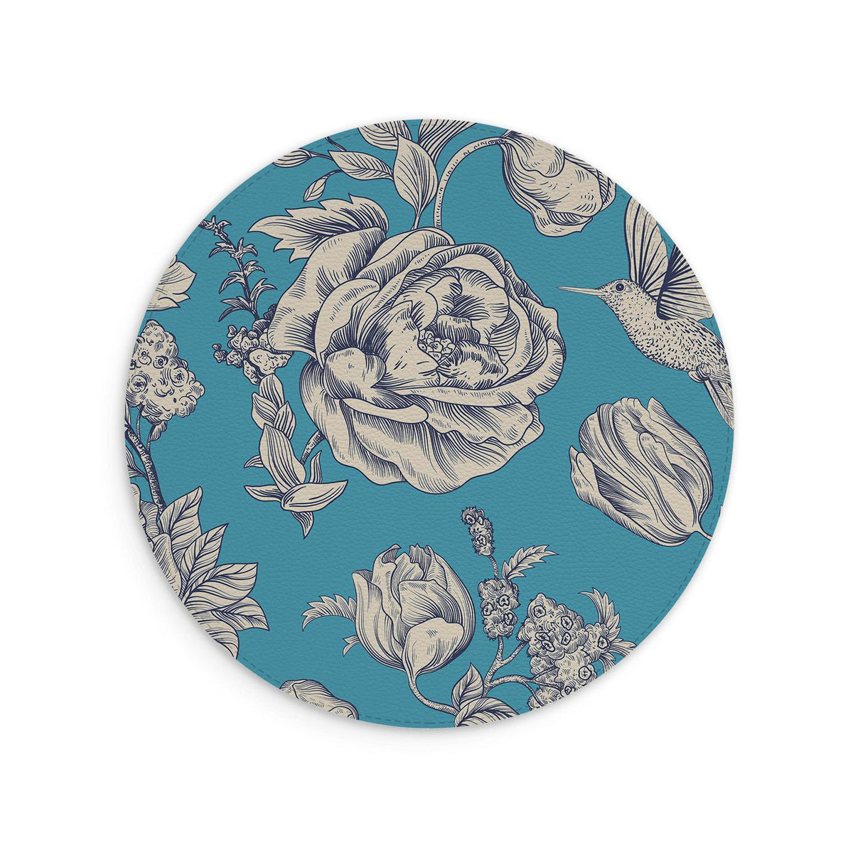Tapis de souris rond en cuir végétal bleu, orné d’un motif floral crème et d’un colibri, avec une finition texturée à croisillons.