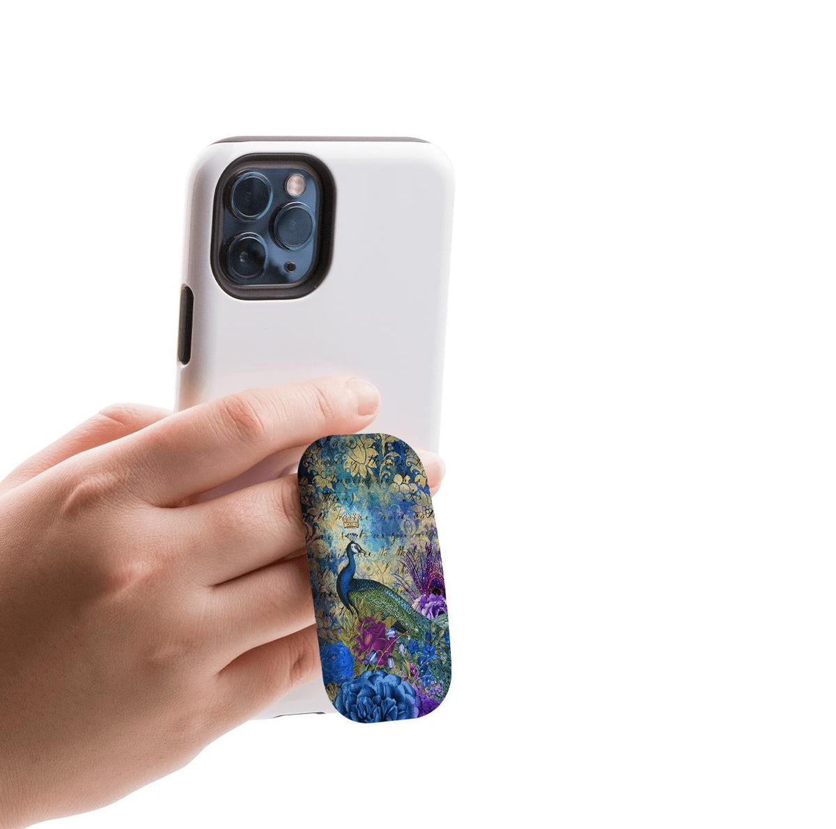 In Heaven Clickit phone stand with a peacock and floral design attached to the back of a white smartphone.