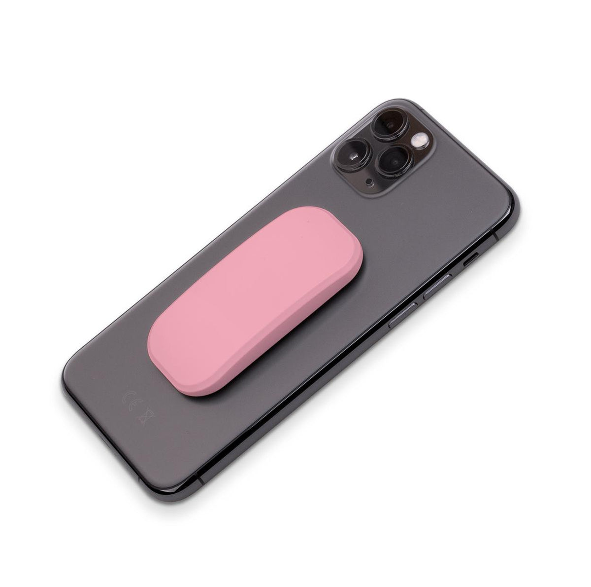 Mell pink adhesive phone stand attached to the back of a black smartphone, isolated on a white background.