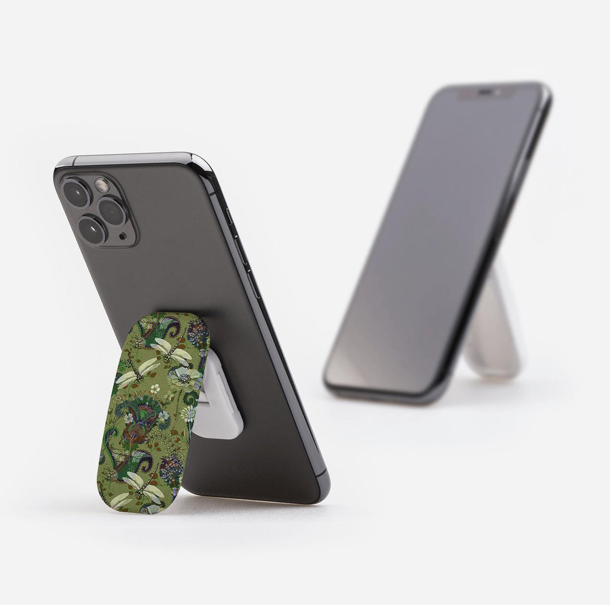 Vyne pattern Clickit phone stand with a green dragonfly and floral print attached to the back of a smartphone.