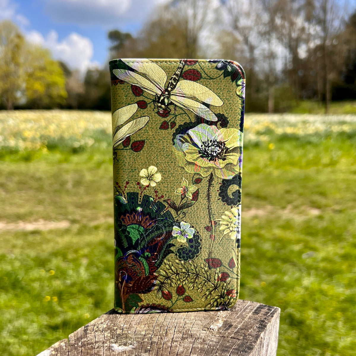 Vyne vegan leather folio phone case with a satin finish, featuring a green dragonfly and floral print design.
